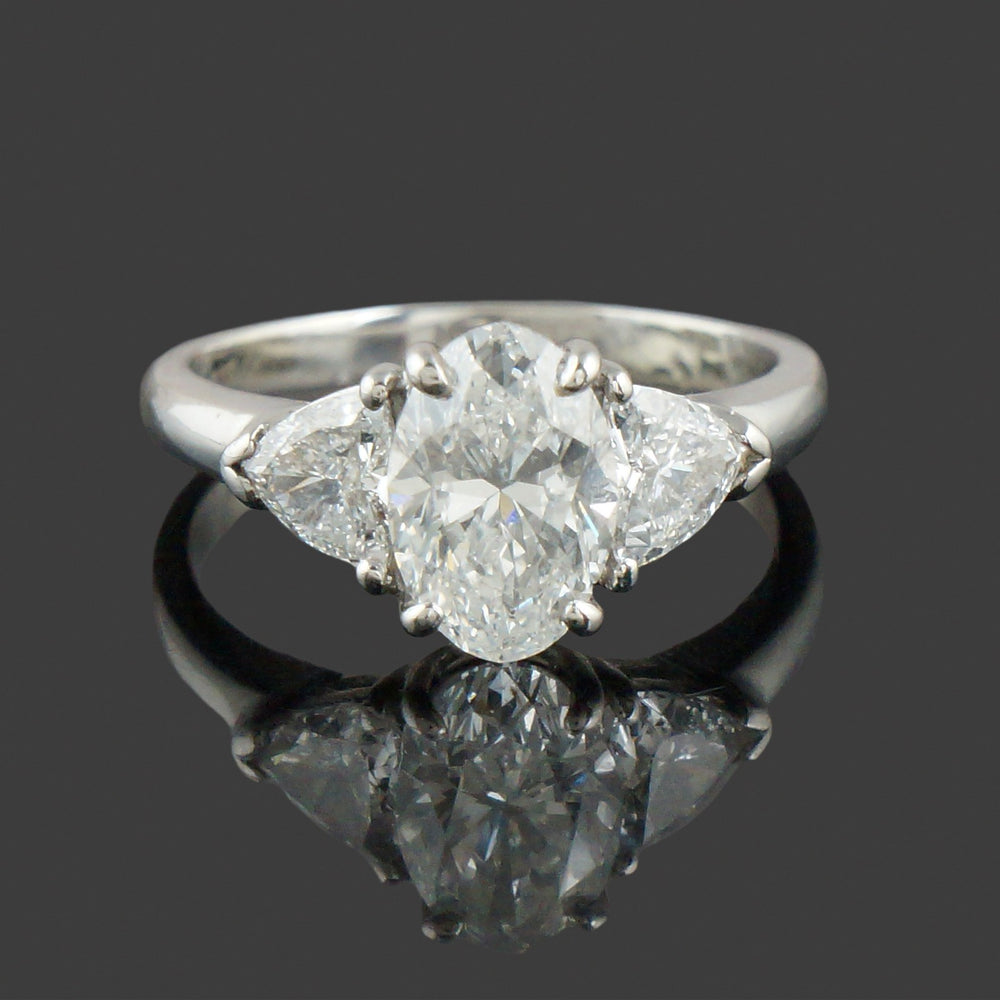 Elegant Platinum, 3.25 CTW Oval & Trillion Diamond Three Stone Engagement Ring