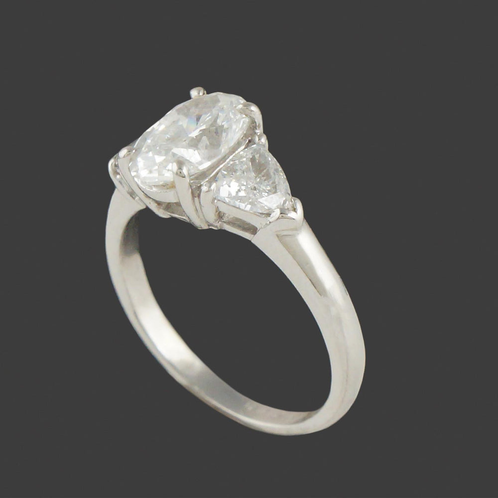 Elegant Platinum, 3.25 CTW Oval & Trillion Diamond Three Stone Engagement Ring, Olde Towne Jewelers, Santa Rosa CA.