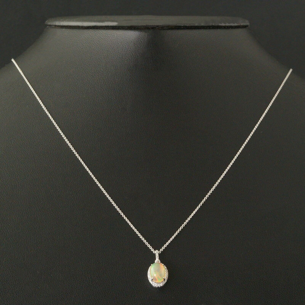 Solid 14K White Gold, 1.5 Ct Opal & .20 CTW Diamond Halo Pendant, 18" Necklace, Olde Towne Jewelers, Santa Rosa CA.